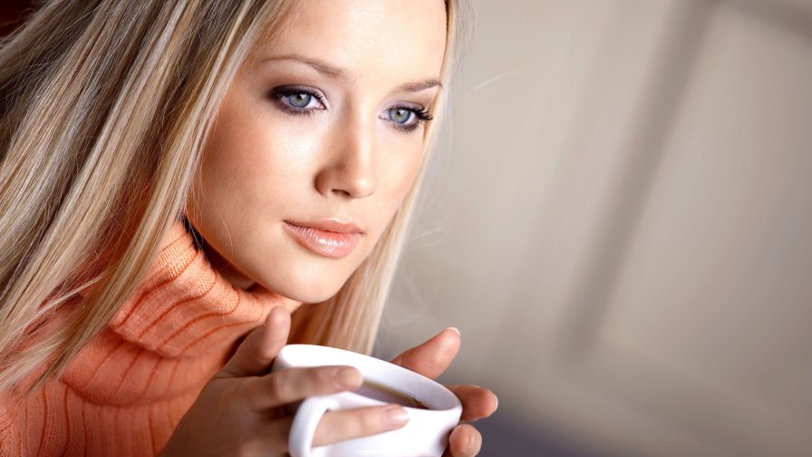 Beautiful Blonde Girl with Cup of Tea