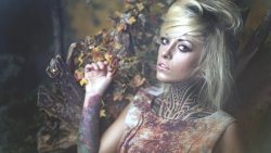 Beautiful Blonde Girl with Tattoo and Piercing