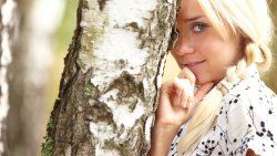 Beautiful Blonde Russian Girl and Birch