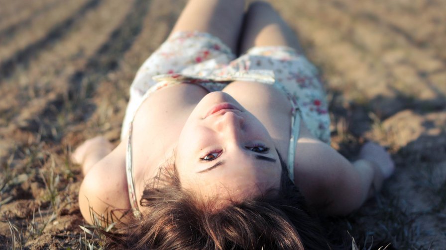 Beautiful Girl Lying on the Ground
