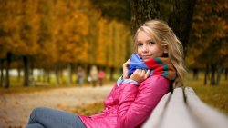 Beautiful Girl with Cute Pretty Face in Autumn Park