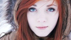Beautiful Girl with Red Hair and Snowflakes