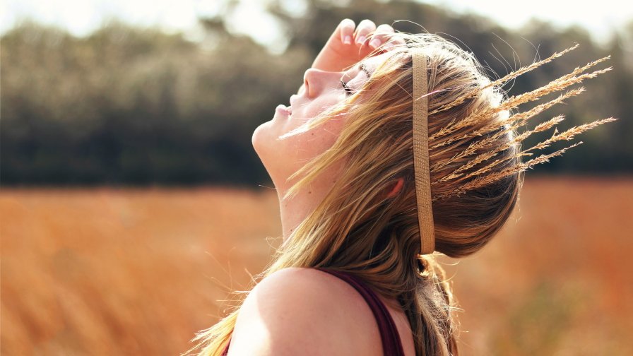 Beautiful Hippie Blonde Girl in Summer Field