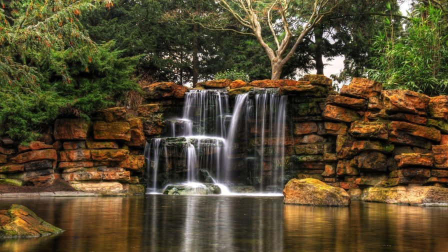 Beautiful Lake and Waterfall in Green Forest