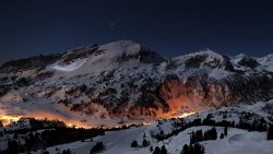 Beautiful Night Snowy Mountains and Village in Valley
