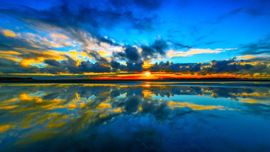 Beautiful Orange Sunset and Blue Clouds in Sky