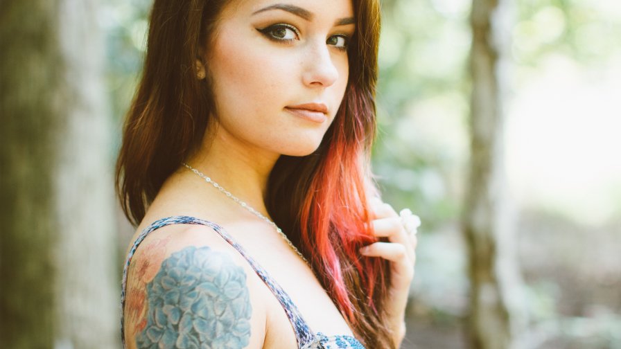 Beautiful Sexy Young Girl with Cute Face and Tattoo