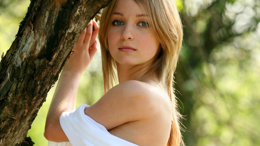 Beautiful Sexy Young Girl with Green Eyes and Cute Face