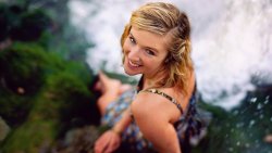 Beautiful Smiling Girl and Waterfall