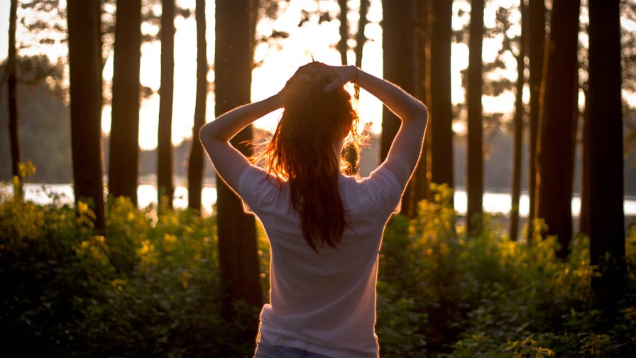 Beautiful Teen Girl Looking on the Sunset