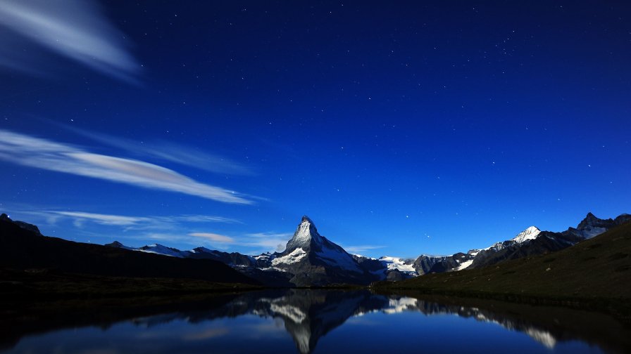 Blue Night Light over The Mountains