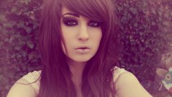 Charming Brunette with Piercing in the Lips and Nose