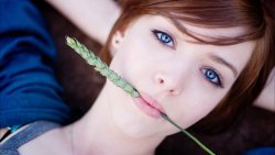 Cute Redhead Girl with Green Grass