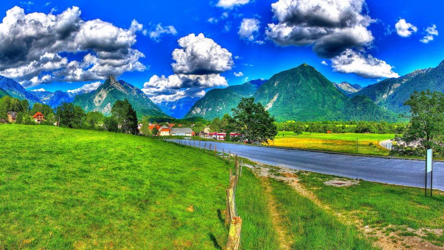 Green Field and Beautiful Mountains