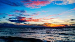 Kiteboarding on Sunset Waves on the Sea