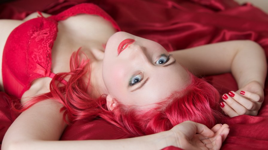 Pink Haired Teen Girl on the Bed