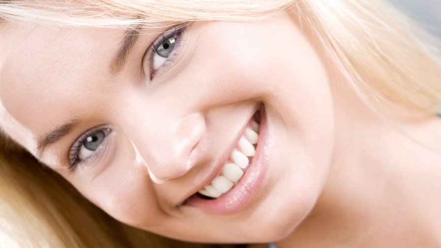 Pretty Beauty Blonde Girl with Perfect Teeth