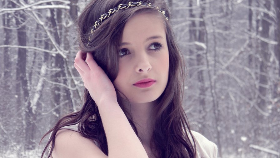 Pretty Young Girl in Winter Forest