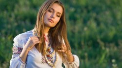 Pretty Young Ukrainian Girl with Embroidery Dress in the Forest