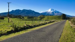 Road in Green Field and Mountains