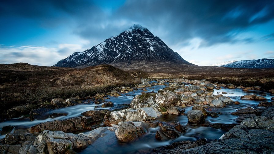 Rocks on River and Mountains