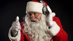 Santa Claus Listening to Music in Headphones