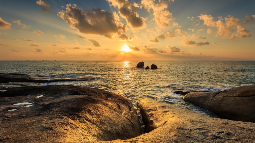 Sea Rocks Clouds in the Sky and Sunset