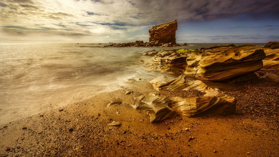 Sea Waves Beach and Yellow Stones