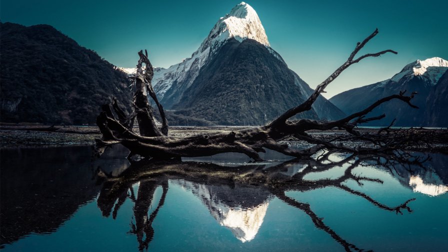 Snowed Mountains Peaks and Lake