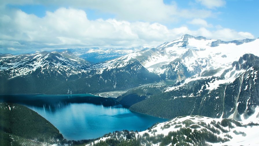 Snowy Mountains and Big Lake in Valley