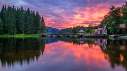 Sunset on the Lake Green Forest and Mountains