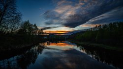 Wonderful Sunset on River Mountains and Forest