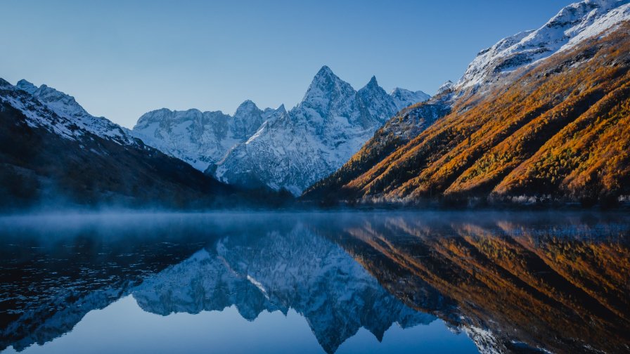 Lake in Mountain Valley and Fog